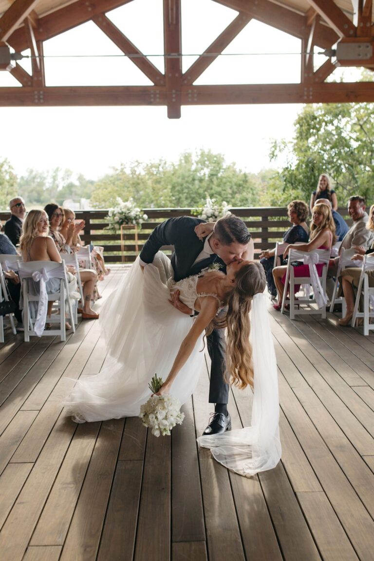 Couple's dip kiss on the 128 South rooftop