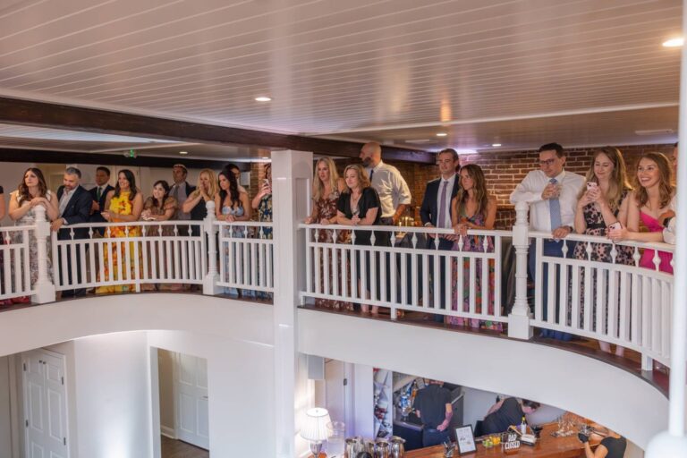 Guests watching from the 128 South mezzanine balcony