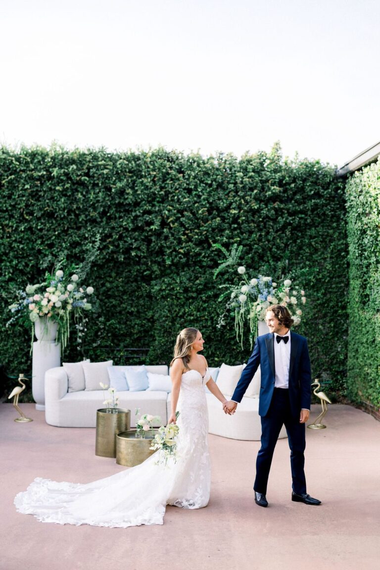 Couple in the ivy-walled courtyard at Bakery 105