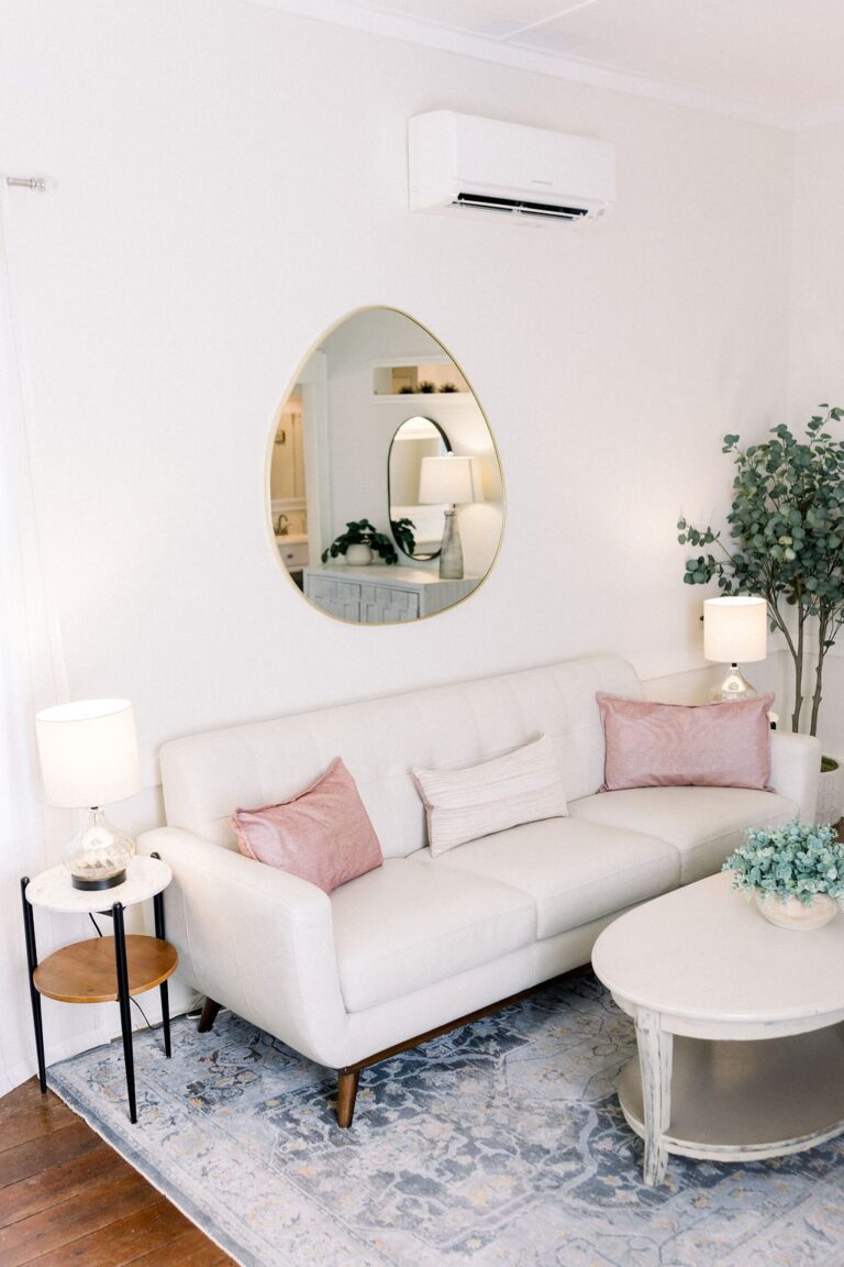 Lounge with oval mirror in The Cottage bridal suite