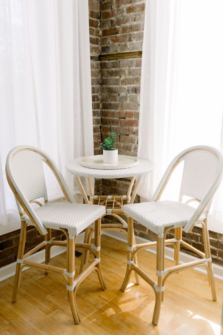 Bistro table by the brick wall in The Loft