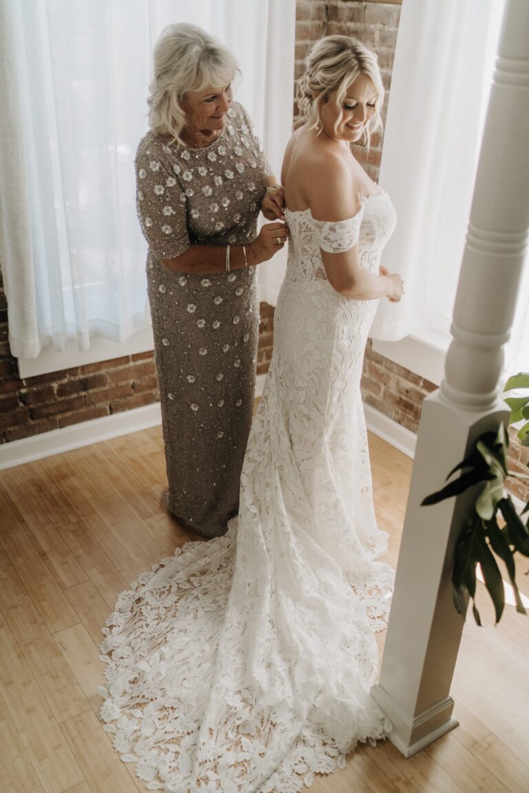 Bride adjusting her shoe in The Loft