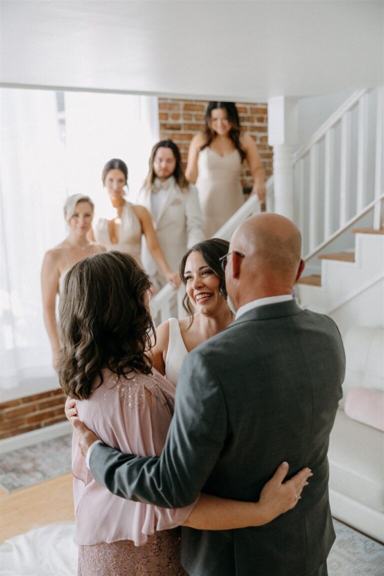 Father embracing the bride in The Loft
